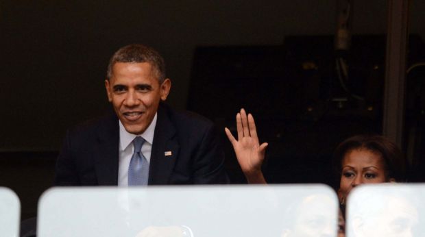 Barack et Michelle Obama pendant l'hommage à Nelson Mandela.