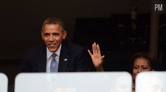 Barack et Michelle Obama pendant l'hommage à Nelson Mandela.