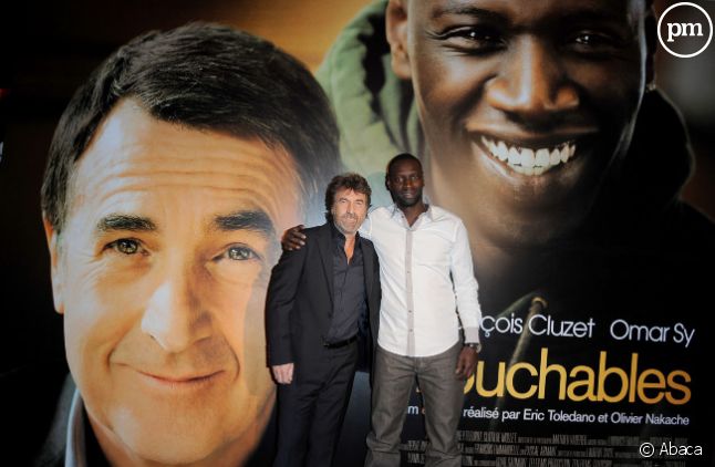 Omar Sy et François Cluzet à une projection du film "Intouchables"