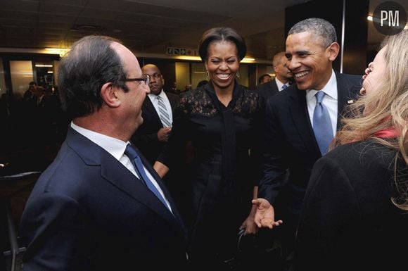 François Hollande face à Barack Obama, lors de l'hommage à Nelson Mandela.