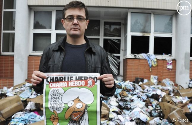 Charb devant les locaux de "Charlie Hebdo" détruits par un cocktail Molotov en 2011